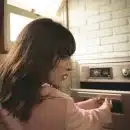 Woman Opening Oven